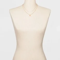 Best deal 🔥 Filigree Disc with Glitter Layered Necklace - A New Day™ Gold 👏